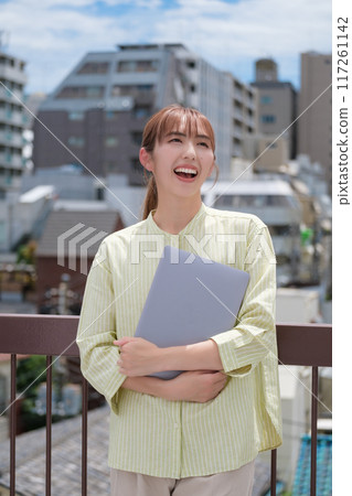 A young woman living her own life positively under the blue sky 117261142