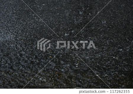 Asphalt flooded by heavy rain 117262355