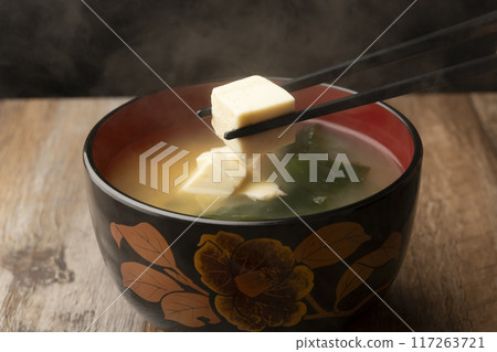 Miso soup: Tofu and wakame miso soup with chopsticks Miso soup: Tofu and wakame miso soup with chopsticks 117263721