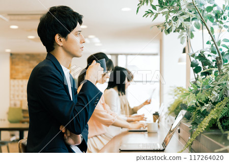 People working in a shared office People working in a shared office 117264020
