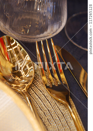 Shiny Silver Spoons on a Wooden Surface with Beautiful Reflections and Elegant Shine 117265128