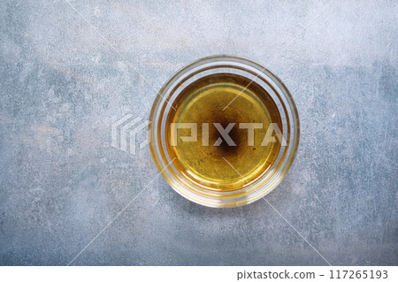 used cooking oil in small bowl  117265193