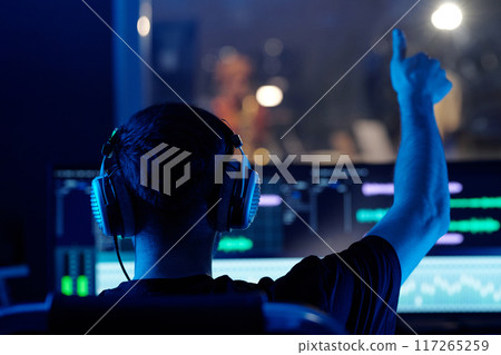 Adjusting Sound Levels in Modern Recording Studio Adjusting Sound Levels in Modern Recording Studio 117265259