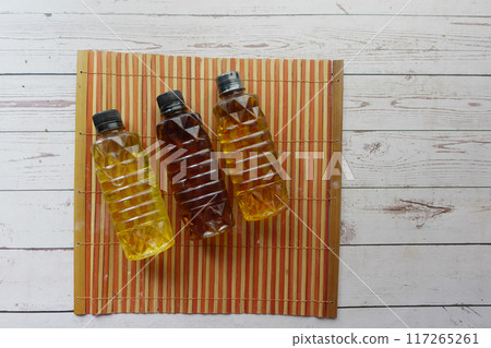 Several bottles of oil arranged on a table for food storage Several bottles of oil arranged on a table for food storage 117265261