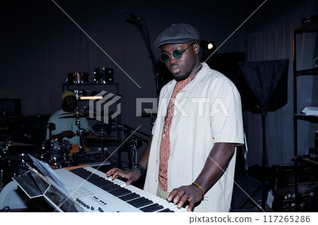Playing Keyboard During Studio Music Session Playing Keyboard During Studio Music Session 117265286