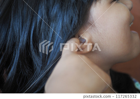 child having ear pain touching his painful ear , child having ear pain touching his painful ear , 117265332