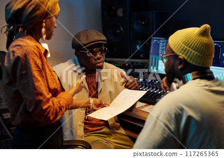 Collaborating on Music Projects in Recording Studio Collaborating on Music Projects in Recording Studio 117265365
