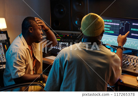 Collaborating in Modern Music Production Studio Session 117265378