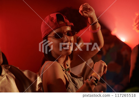 Happy young woman in stylish sunglasses 117265518