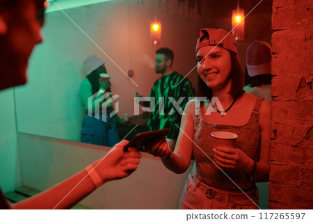 Girl with soda and her boyfriend in club Girl with soda and her boyfriend in club 117265597