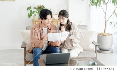 A couple considering the layout of their house 117266385