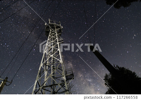 A steel tower and the Orion constellation shining in the night sky 117266558