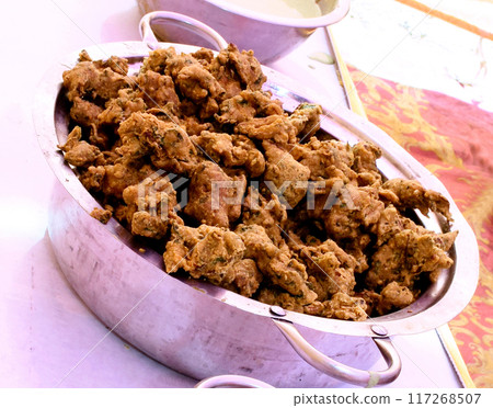 Crispy onion bhajis or kanda or pyaj ke pakore or pakoda 117268507