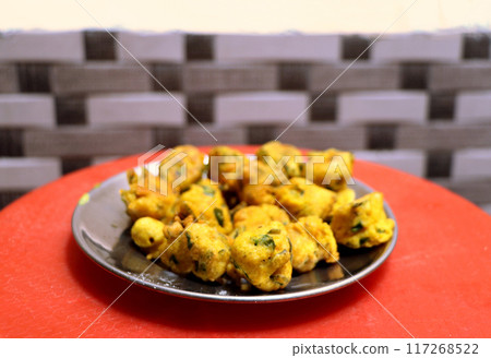Popular street food item mix bhajiya snacks or Pakoda or Pakora Popular street food item mix bhajiya snacks or Pakoda or Pakora 117268522