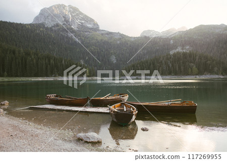 View of the Black Lake or Crno jezero , northern Montenegro. Tourist boats near wooden pier on Black lake in Durmitor national park near Zabljak, Europe 117269955