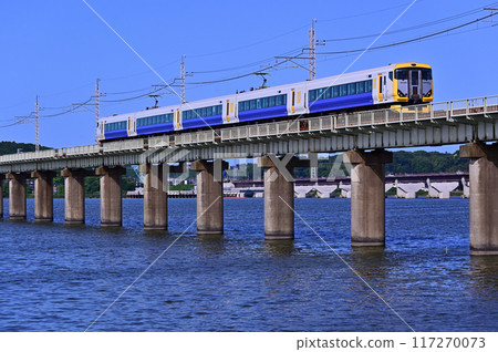 E257 series train crossing Kitaura Bridge E257 series train crossing Kitaura Bridge 117270073
