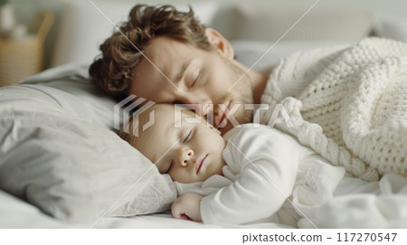 Caucasian couple father and baby are sleeping on bed with grey pillows and soft fabric blankets in modern white bedroom together Caucasian couple father and baby are sleeping on bed with grey pillows and soft fabric blankets in modern white bedroom together 117270547