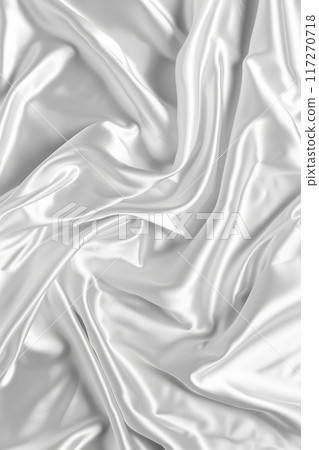 Close-up view of white fabric with slight curl, smooth texture and rough surface. Fabric possibly silk or satin, background blurred to focus on texture. 117270718