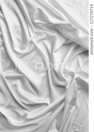 Close-up view of white fabric with soft texture, possibly cotton linen. Fabric slight wrinkles, grid-like pattern in shades of green, black. Background blurred to focus on fabric intricate design. 117270719