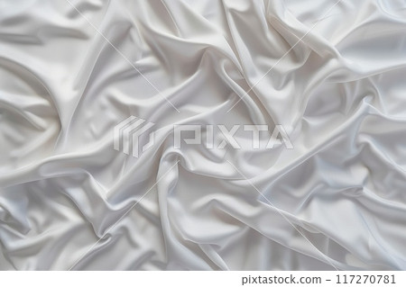 Close-up view of white fabric with subtle texture, folded and creased. Fabric curled edges add depth. Blurred background highlights fabric details. Soft atmosphere created by white. Close-up view of white fabric with subtle texture, folded and creased. Fabric curled edges add depth. Blurred background highlights fabric details. Soft atmosphere created by white. 117270781