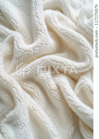 White fabric with slightly curled texture folded in half reveals intricate pattern adding depth. Fabric appears smooth, soft. Focus on fabric as main subject. White fabric with slightly curled texture folded in half reveals intricate pattern adding depth. Fabric appears smooth, soft. Focus on fabric as main subject. 117270879
