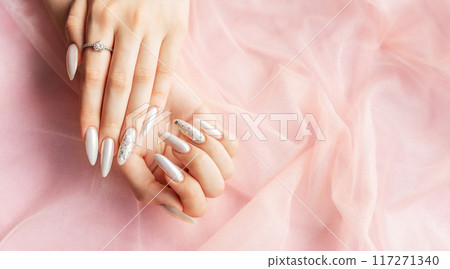 Female Hands with beautiful pearl manicure Female Hands with beautiful pearl manicure 117271340