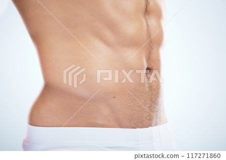 Fitness, wellness and body of man in studio with muscles for healthy lifestyle, workout and bodybuilder training. Motivation, exercise and muscular torso, abdomen and stomach of athlete in underwear Fitness, wellness and body of man in studio with muscles for healthy lifestyle, workout and bodybuilder training. Motivation, exercise and muscular torso, abdomen and stomach of athlete in underwear 117271860