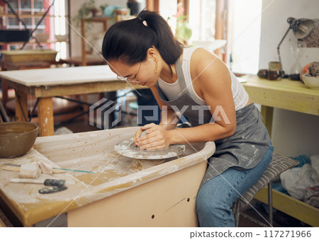 Clay, pottery or woman in art workshop working on a cup sculpture or mug mold in small business. Focus, artistic girl or Japanese creative designer manufacturing handicraft products as entrepreneur Clay, pottery or woman in art workshop working on a cup sculpture or mug mold in small business. Focus, artistic girl or Japanese creative designer manufacturing handicraft products as entrepreneur 117271966