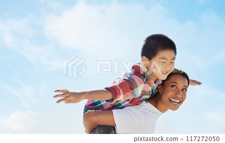 Mom, piggyback airplane and child by sky with smile, family bonding or outdoor vacation in summer. Happy family, interracial and black woman back for asian adoption, love or game on holiday adventure Mom, piggyback airplane and child by sky with smile, family bonding or outdoor vacation in summer. Happy family, interracial and black woman back for asian adoption, love or game on holiday adventure 117272050