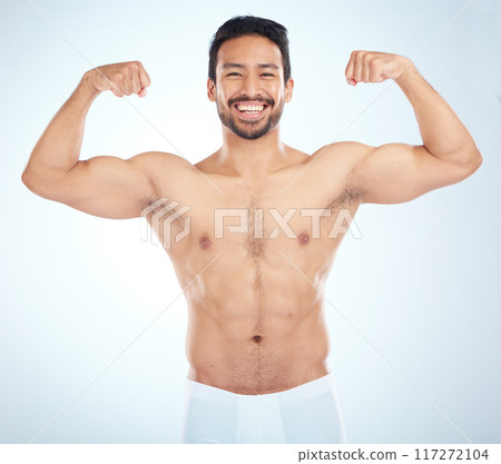 Fitness, biceps and portrait of a man flexing in a studio after an arm muscle training workout. Sports, health and strong Asian male bodybuilder after a strength exercise isolated by white background 117272104