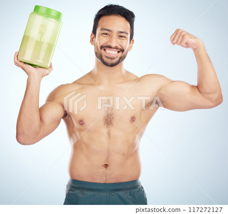 Fitness, studio or strong man with protein shake in training, exercise or body workout supplements for energy. Face portrait, mockup or healthy bodybuilder with bottle for muscle growth nutrition 117272127