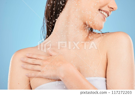 Water splash, shower and woman cleaning body, skincare and hygiene while washing in blue studio background. Water drops or cosmetics for self care, skin model or healthy skin, clean and fresh beauty 117272203