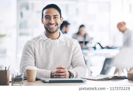Smile, marketing and businessman happy in a coworking office at a corporate agency. Ready, excited and portrait of an employee working at a desk with commitment, creativity and happiness at work Smile, marketing and businessman happy in a coworking office at a corporate agency. Ready, excited and portrait of an employee working at a desk with commitment, creativity and happiness at work 117272229