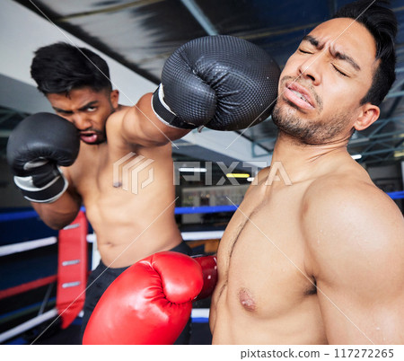 Fitness, exercise and boxing match, punch or knock out in ring. Healthcare, sports or boxers, athletes or fighters fighting in competition, training or workout for wellness in gym or fitness center. Fitness, exercise and boxing match, punch or knock out in ring. Healthcare, sports or boxers, athletes or fighters fighting in competition, training or workout for wellness in gym or fitness center. 117272265