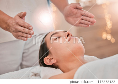 Woman, hands or relax reiki spa for stress management, headache relief or healthcare wellness in holistic clinic. Energy healer, man or mind chakra peace for sleeping patient and special effects glow 117272422