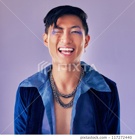Punk, rock and makeup of a man with a smile for metal music, lifestyle and identity against a purple studio background. Freedom, crazy and face portrait of a cyberpunk Asian person with cosmetics 117272440