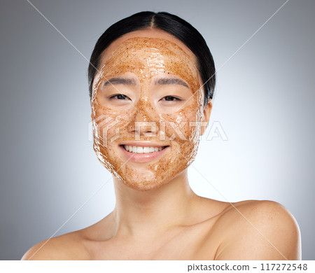 Woman with face mask, korean skincare spa with natural sugar scrub product or portrait in gray background studio. Face of happy asian girl, wellness beauty with cleaning exfoliation or facial smile 117272548