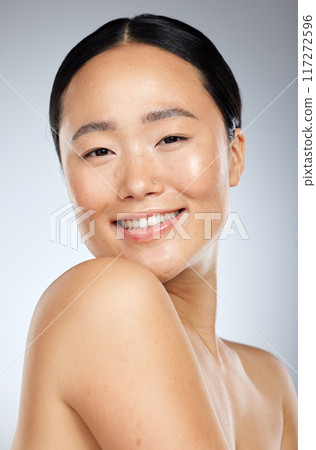 Beauty, asian and skincare with portrait of woman and smile for spa, cosmetics and clean wellness. Happy, makeup and facial treatment with girl for luxury, health and model in gray background studio Beauty, asian and skincare with portrait of woman and smile for spa, cosmetics and clean wellness. Happy, makeup and facial treatment with girl for luxury, health and model in gray background studio 117272596