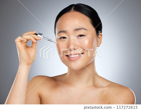 Woman beauty, facial serum and essential oil portrait, aesthetic makeup and glowing skincare on studio background in Tokyo. Japanese model face, liquid cosmetic product and hyaluronic acid wellness 117272615