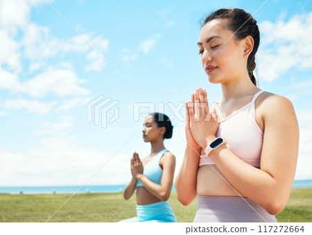 Meditation, fitness and yoga women in park or beach with blue sky mock up for wellness, mindfulness and inner healing. Fitness, calm and pilates friends meditate with peace mindset in nature mockup Meditation, fitness and yoga women in park or beach with blue sky mock up for wellness, mindfulness and inner healing. Fitness, calm and pilates friends meditate with peace mindset in nature mockup 117272664