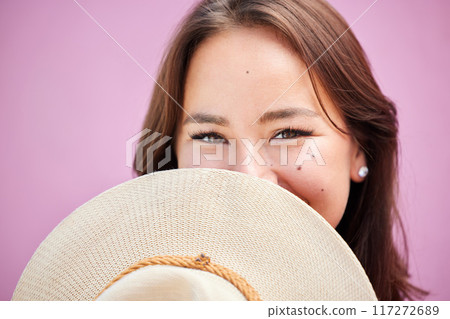 Fashion, woman and shy face with straw hat on pink studio background. Portrait, happy or beauty, mysterious and Asian model from Japan cover or hiding in cool, retro or stylish, vintage or summer hat Fashion, woman and shy face with straw hat on pink studio background. Portrait, happy or beauty, mysterious and Asian model from Japan cover or hiding in cool, retro or stylish, vintage or summer hat 117272689