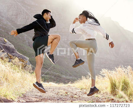Fitness, nature and couple exercise in mountain hill, jump wellness and outdoor cardio workout on dust path. Motivation, health and sport partnership or friends in sports training or active lifestyle Fitness, nature and couple exercise in mountain hill, jump wellness and outdoor cardio workout on dust path. Motivation, health and sport partnership or friends in sports training or active lifestyle 117272723