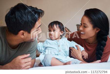 Down syndrome, mother and father bonding with child smile, happy and together at home for quality time. Family, man and woman with baby, kid and newborn with disability, special needs and cuddle. 117272794