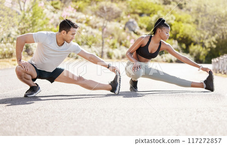 Couple stretching, nature training and interracial team running for cardio exercise, motivation for run and start of workout journey together. Runner man and woman doing stretch for fitness in park 117272857