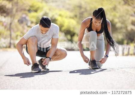 Exercise, motivation and woman with personal trainer start run in nature, cardio health in summer. Tie shoes, energy and wellness workout with man asian man and black woman training in a road Exercise, motivation and woman with personal trainer start run in nature, cardio health in summer. Tie shoes, energy and wellness workout with man asian man and black woman training in a road 117272875