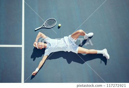 Tired tennis player, sports burnout and game fatigue on court sport training, muscle injury from exercise on ground and sad about mistake. Depressed and Asian athlete upset about competition loss 117272921