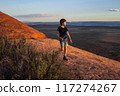 Boy Hiking at Sunset on Devils Garden Trail, Utah 117274267