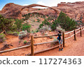 Landscape Arch with Young Tourist Boy, Utah 117274363