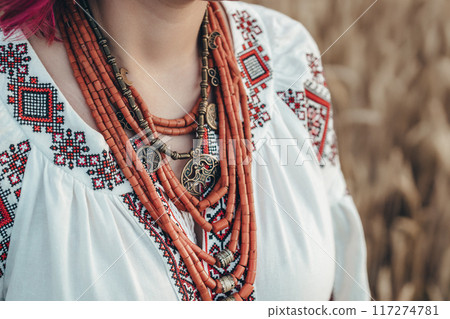 Woman Wearing Traditional Antique Jewelry Necklace. National Costume Of Ukraine Woman Wearing Traditional Antique Jewelry Necklace. National Costume Of Ukraine 117274781