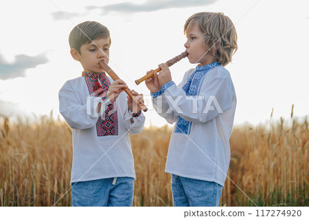 Little Boys Playing Folk Music On Woodwind Flutes - Ukrainian Sopilka Or Tylynka 117274920